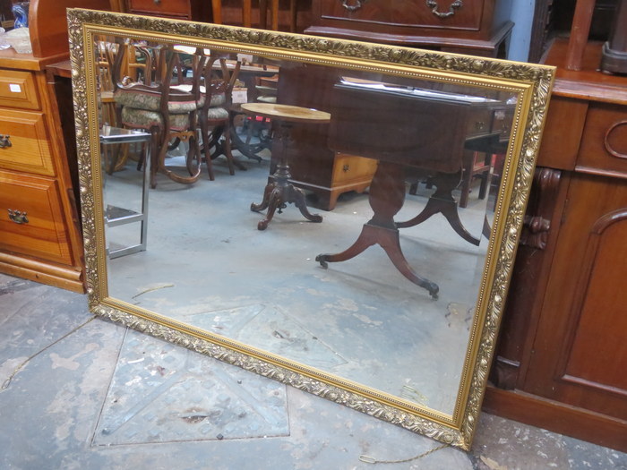 LARGE GILDED AND BEVELLED WALL MIRROR,