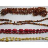 THREE STRANDS OF AMBER BEADS AND TWO OTHER BEADS,