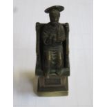 SMALL BRONZE COLOURED AND METAL SEATED RELIGIOUS FIGURE