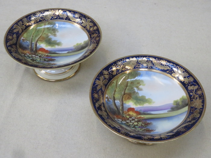 PAIR OF NORITAKE HANDPAINTED AND GILDED STEMMED CAKE STANDS,