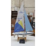 REMOTE CONTROL YACHT WITH ELECTRIC MOTOR AND HAND CONTROL ON STAND