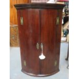 18th CENTURY MAHOGANY BOW FRONTED WALL MOUNTING CORNER CUPBOARD