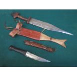 TWO AFRICAN 20th CENTURY DAGGERS WITH LEATHER SCABBARDS