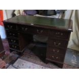 20th CENTURY MAHOGANY NINE DRAWER LEATHER TOPPED WRITING DESK