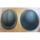 1950s/60s EUROPEAN COMBAT HELMET AND WORLD WAR II FRENCH ADRIAN PATTERN HELMET.