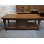 20th CENTURY OAK LINEN FOLD FRONTED TWO TIER COFFEE TABLE