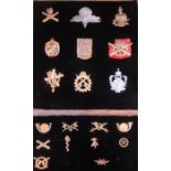 COLLECTION OF NINE EUROPEAN ARMY CAP BADGES AND TEN COLLAR BADGES