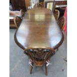 20th CENTURY EXTENDING DINING TABLE AND SIX OAK WHEEL BACK CHAIRS