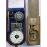 VINTAGE CASE TACHOMETER AND SMALL WOODEN CASED VICE