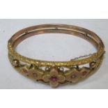 VICTORIAN 9ct GOLD PIERCEWORK DECORATED SNAP BANGLE WITH RUBY COLOURED STONE AND CLEAR STONES