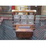 OAK THREE DECANTER TANTALUS (AT FAULT) AND ROSEWOOD SECTIONAL TEA CADDY
