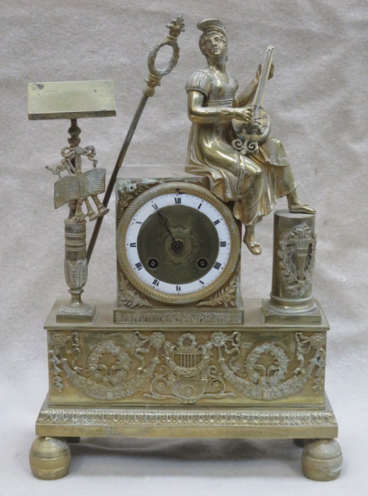 19th CENTURY FRENCH GILT METAL SEATED FIGURE FORM MANTLE CLOCK WITH ENAMELLED DIAL,