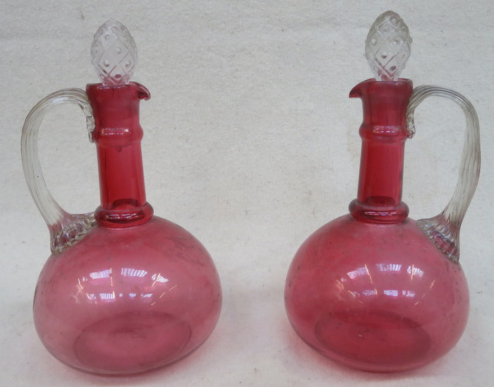 PAIR OF 19th CENTURY CRANBERRY GLASS DECANTERS WITH STOPPERS,