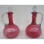 PAIR OF 19th CENTURY CRANBERRY GLASS DECANTERS WITH STOPPERS,
