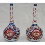 PAIR OF LATE 19th CENTURY ORIENTAL BOTTLE NECK VASES, HANDPAINTED IN THE IMARI PALETTE (RESTORED),