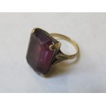 9ct GOLD DRESS RING SET WITH LARGE AMETHYST COLOURED STONE