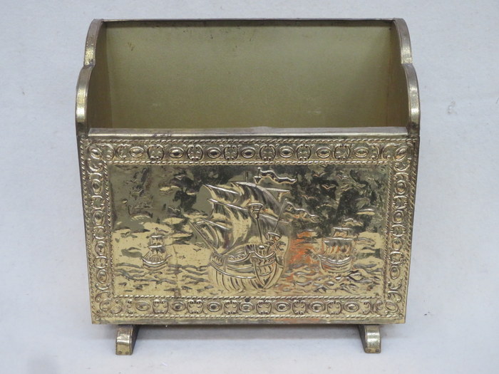 VINTAGE BRASS MAGAZINE RACK WITH REPOUSSE DECORATED GALLEONS AT SEA