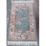20th CENTURY FIRESIDE FLOOR RUG DECORATED IN THE ORIENTAL MANNER,