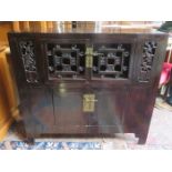 ORIENTAL LACQUERED AND PIERCEWORK DECORATED STORAGE CABINET