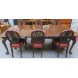 MAHOGANY EXTENDING DINING TABLE WITH TWO LEAVES AND SIX BERGERE BACKED DINING CHAIRS