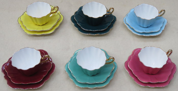 SET OF SIX ROYAL STUART HARLEQUIN GILDED CERAMIC TRIOS BY SPENCER STEVENSON