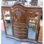 VICTORIAN CARVED AND BOW FRONTED MAHOGANY TRIPLE WARDROBE