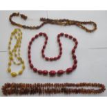 THREE STRANDS OF AMBER BEADS AND TWO OTHER BEADS,