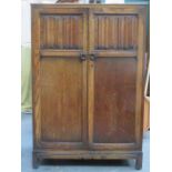 OAK TWO DOOR LINENFOLD FRONTED CHILD'S WARDROBE