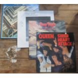 FOUR VINYLS INCLUDING THE BEATLES, QUEEN,