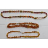 THREE STRANDS OF AMBER BEADS