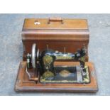 WALNUT CASED JONES SEWING MACHINE