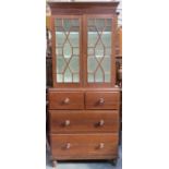 19th CENTURY OAK TWO DOOR ASTRAGAL GLAZED BOOKCASE UPON TWO OVER TWO CHEST BASE