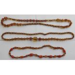 THREE STRANDS OF AMBER BEADS