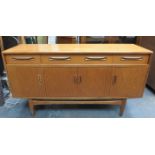 G PLAN 20th CENTURY TEAK FOUR DOOR SIDEBOARD FITTED WITH THREE DRAWERS ABOVE