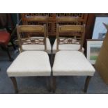 SET OF FOUR PIERCEWORK DECORATED MAHOGANY DINING CHAIRS