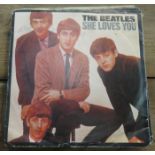 BEATLES SINGLES INCLUDING SHE LOVES YOU, FROM ME TO YOU, TWIST & SHOUT AND LOVE ME DO,