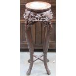 HEAVILY CARVED AND PIERCEWORK DECORATED MARBLE TOPPED PLANT STAND.