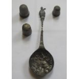 SILVER APOSTLE TYPE SPOON AND THREE THIMBLES.