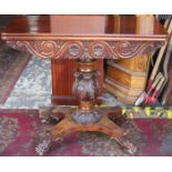 HEAVILY CARVED ANTIQUE WALNUT FOLD OVER GAMES TABLE ON QUADRAFOIL CLAW SUPPORTS