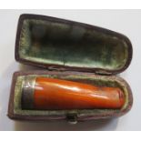 CASED SILVER MOUNTED AMBER CHEROOT HOLDER.