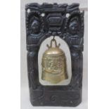 RELIEF DECORATED ORIENTAL BRASS BELL ON CARVED MAHOGANY PIERCEWORK STAND