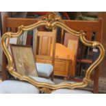 VICTORIAN STYLE GILDED SHAPED WALL MIRROR.