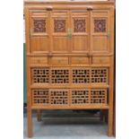 CARVED PIERCEWORK DECORATED ORIENTAL CABINET WITH FOUR DOORS TO TOP,