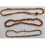 THREE STRANDS OF AMBER BEADS