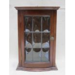 SMALL MAHOGANY SINGLE DOOR BOW FRONTED AND LEADED GLASS WALL MOUNTING CUPBOARD