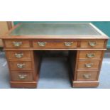 LATE 19th/EARLY 20th CENTURY MAHOGANY NINE DRAWER PEDESTAL WRITING DESK WITH GREEN LEATHER INSERT