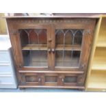 20th CENTURY PRIORY STYLE OAK TWO DOOR LEADED GLASS BOOKCASE WITH TWO DOORS BELOW