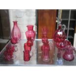 MIXED LOT OF CRANBERRY COLOURED GLASSWARE INCLUDING DECANTERS AND JUGS, ETC.