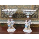 PAIR OF CONTINENTAL HANDPAINTED AND GILDED FIGURE FORM TAZZAS,