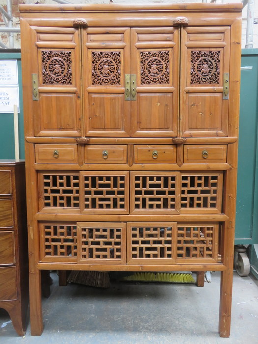 CARVED PIERCEWORK DECORATED ORIENTAL CABINET WITH FOUR DOORS TO TOP,